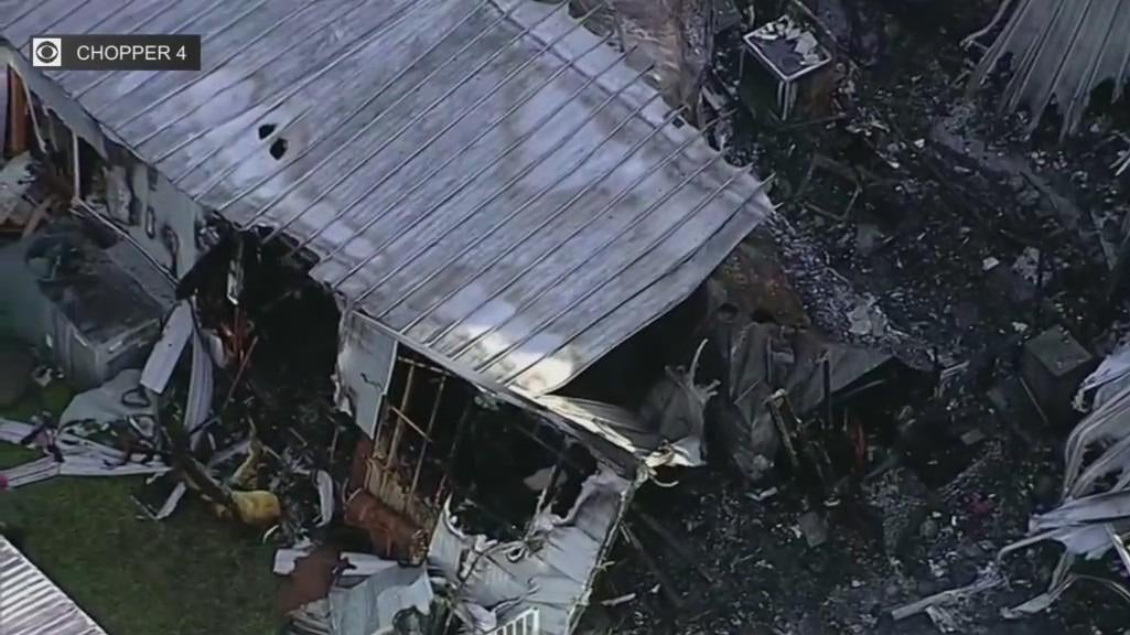 Davie woman says her dog saved her from mobile home fire - CBS Miami