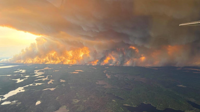 Canadian wildfires force tens of thousands evacuate, threaten U.S. air ...