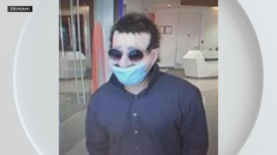 FBI releases photos of masked suspect in Broward bank robbery - CBS Miami