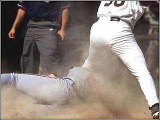 Florida Marlins' Jeff Conine, right, is congratulated by teammate Mike  Lowell after connecting on a two-run home run against Atlanta Braves  pitcher Mike Hampton during the first inning Saturday, April 24, 2004