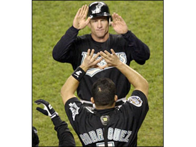 Florida Marlins Jeff Conine(18) celebrates with teammates after scoring in  the 5th inning against the New York Yankees in game 5 of the 2003 MLB World  Series, at Pro Player Stadium, Miami