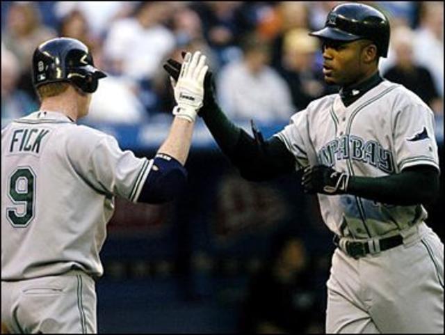 Cincinnati Reds' Ken Griffey Jr. celebrates with teammates Sean