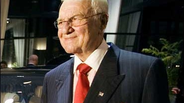 Lee Iaccoca poses with the new custom made Maybach 57 S as the car is unveiled at the Mercedes-Benz of Beverly Hills dealership on Oct. 18, 2005, in Beverly Hills, Calif. 