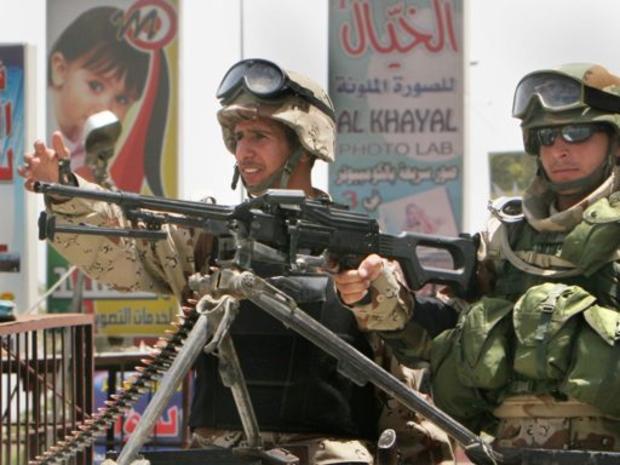 Iraqi soldiers man a checkpoint 