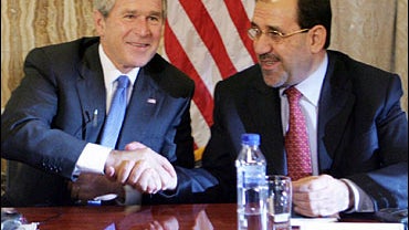 President Bush, left, shakes hands with Iraqi Prime Minister Nouri al-Maliki 