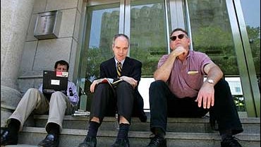 New York Times journalists Nick Kristoff, left, and Joe Kahn, center, and International Herald Tribune reporter David Lague. 