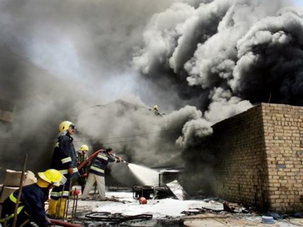 Iraqi firefighters try to extinguish fires 
