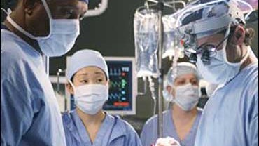 Actors James Pickens, Jr., Sandra Oh  and Patrick Dempsey in this scene from the television series Actors James Pickens, Jr., left, Sandra Oh, second from left, and Patrick Dempsey, right, appear  in a scene from 