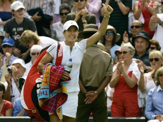 Justine Henin-Hardenne of Belgium waves to the crowd 