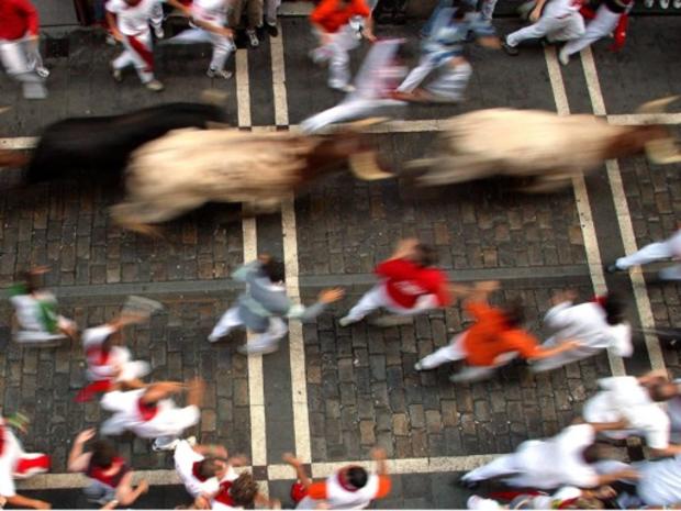 Charging bulls run during the first run of the famous San Fermin festival, in Pamplona 
