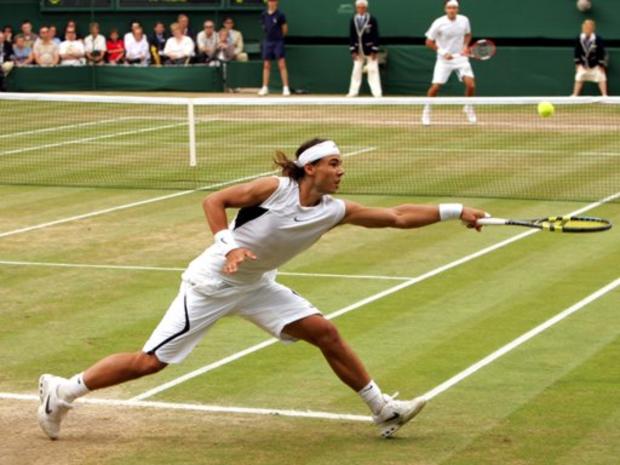 Spain's Rafael Nadal reaches for a shot from Roger Federer 