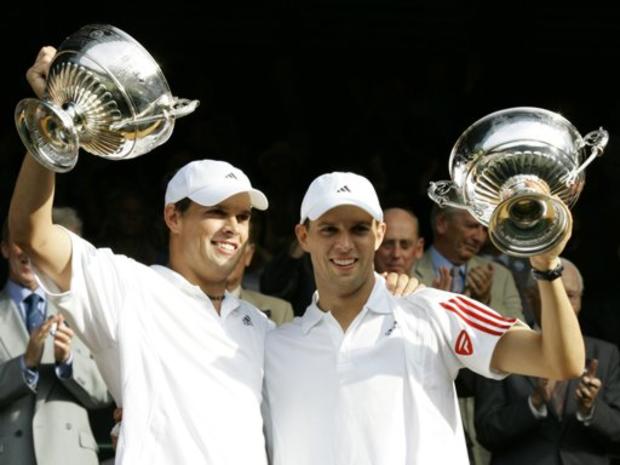 Brothers Mike Bryan, right, and Bob Bryan of the United States hold the Men's Doubles trophies 