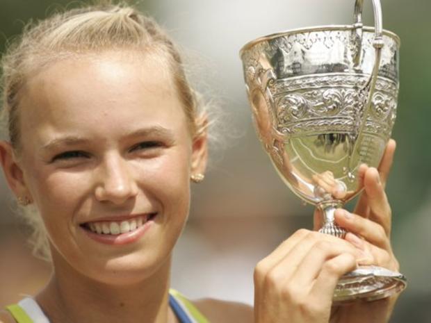 Denmark's Caroline Wozniacki holds the Girl's Championship trophy 