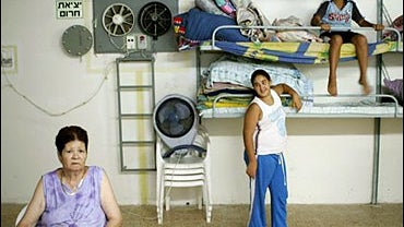 Israelis sit in a shelter in the northern costal town of Nahariya 
