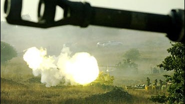 An Israeli heavy artillery piece fires at a target in southern Lebanon 
