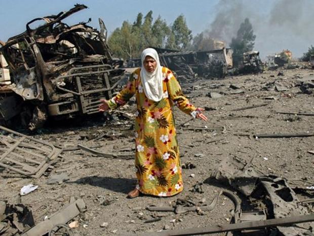 Lebanese woman reacts after she inspected her truck that was destroyed 