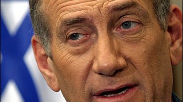 Israeli Prime Minister Ehud Olmert speaks prior to his monthly meeting with Israeli President Moshe Katsav, not seen, at Katsavs' residency Tuesday Aug. 8, 2006 