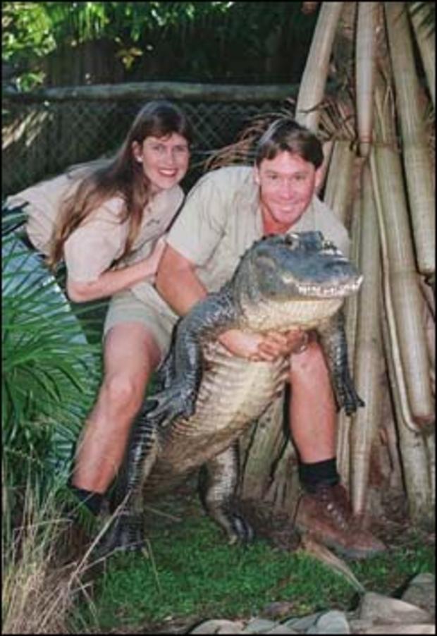 Steve Irwin of the TV show "The Crocodile Hunter" poses with his wife Terri while holding a nine-foot alligator at his "Australia Zoo," Beerwah, Queensland, Australia, June 18, 1999. 