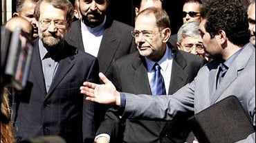 Iran's top nuclear negotiator Ali Larijani and European Union foreign policy chief Javier Solana, from left, leave the federal chancellery in Vienna, Sunday, Sept. 10, 2006. 