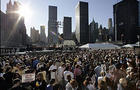 The sun rises over thousands of mourners during a ceremony Monday, Sept. 11, 2006 at the World Trade Center site in New York marking 