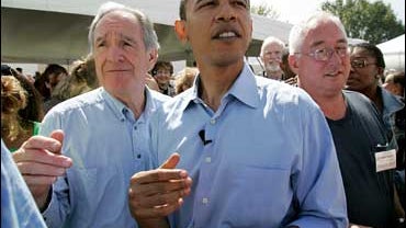 Sen. Barack Obama, D-Illinois, center, makes his way through the crowd with Sen. Tom Harkin, D-Iowa, left, before speaking to local Democrats at Harkin's annual fundraising steak fry dinner, Sunday, Sept. 17, 2006, in Indianola, Iowa. 