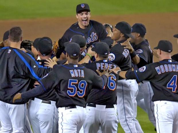 New York Mets third baseman David Wright, top, reacts after the Mets beat the Florida Marlins, 4-0, to clinch the National League Eastern Division during MLB baseball Monday night, Sept. 18, 2006 at Shea Stadium in New York. 
