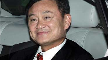 Ousted Thai Prime Minister Thaksin Shinawatra leaves London Gatwick airport for central London. 