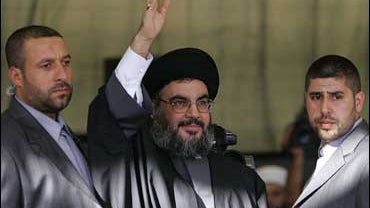 Nasrallah waves to supporters at rally 