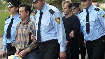 Georgian police escort Russian spy suspects 