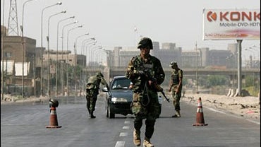 Iraqi army soldiers man one of Baghdad's many checkpoints, Sept. 30, 2006. 