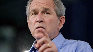 President Bush gestures as he speaks to supporters at campaign rally at Georgia Southern University Hanner Athletic Complex 