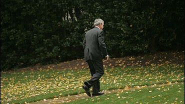 President Bush walks into the Oval Office at the White House to wait for election results, after months of campaigning for GOP candidates all over the country, Nov. 7, 2006 
