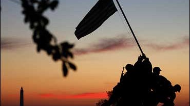 The early morning sun begins to rise behind the U.S. Marine Corp's Iwo Jima Memorial on Veterans Day November 11, 2006 in Arlington, Virginia. 