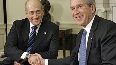 President Bush shakes hands with Israeli Prime Minister Ehud Olmert in the Oval Office of the White House 