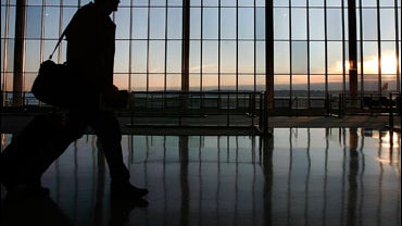 A traveler walks thru the terminal at Reagan National Airport November 21, 2006 in Arlington, Virginia. 