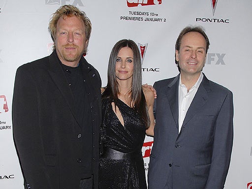 John Landgraff (R) arrives at the premiere of the 