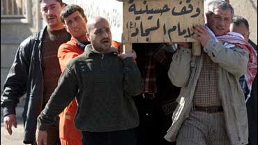 iraqis carry coffin 