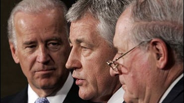 Sen. Chuck Hagel, R-Neb., center, flanked by Senate Foreign Relations Committee Chairman Sen. Joseph Biden, D-Del., left, and Senate Armed Services Committee Chairman Sen. Carl Levin, D-Mich., speaks during a news conference on Capitol Hill in Washington, 