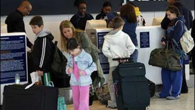 JetBlue passengers check in at JFK airport on Tuesday, Feb. 20, 2007. 