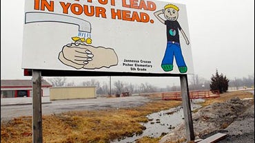 A sign that reads "Don't Put Lead In Your Head" is placed on the main street going through Picher, Okla., Monday, Feb. 12, 2007. 