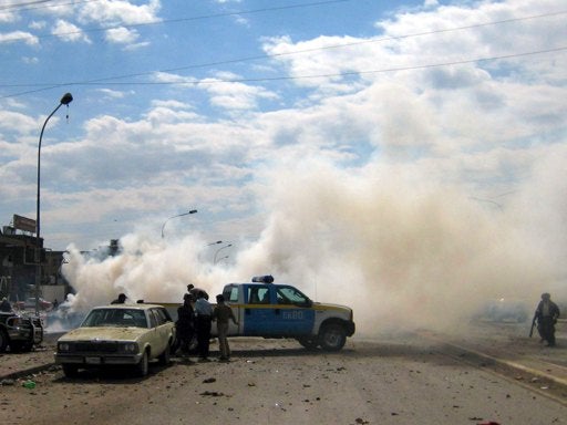 Smoke rises at a car bombing scene in Kirkuk, Iraq 