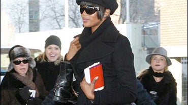 Naomi Campbell enters a Department of Sanitation facility 