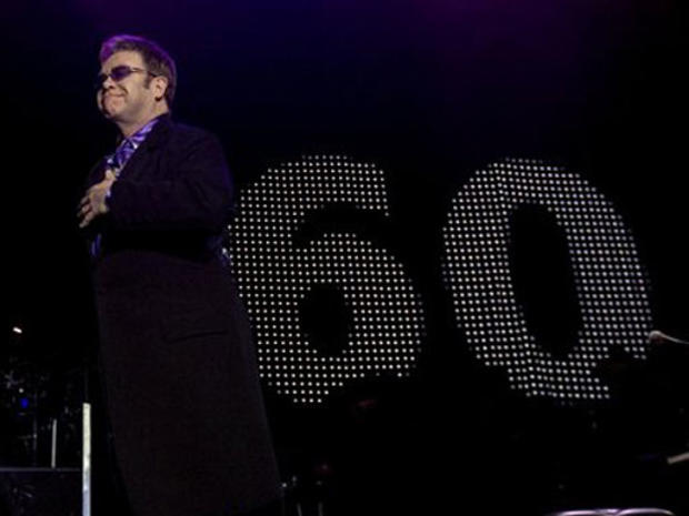 British singer/songwriter Sir Elton John performs with his band at the Dunkin Donuts Center in Providence, R.I., Thursday, Mar. 22, 2007. John will turn 60 on Sunday, Mar. 25, 2007 and big birthday celebration is scheduled during his concert at Madison Sq 