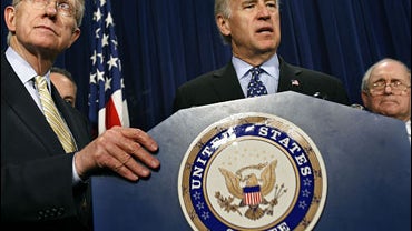 Senate Majority Leader Harry Reid (D-NV), Sen. Joseph Biden (D-DE) and Sen. Carl Levin (D-MI) hold a news conference at the US Capitol March 27, 2007 in Washington, DC. 