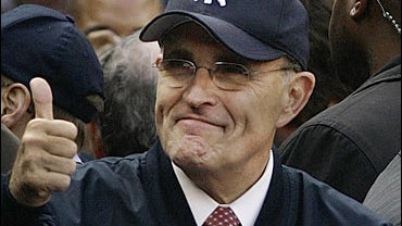 Republican presidential candidate Rudy Giuliani gives the thumbs up sign to fans 