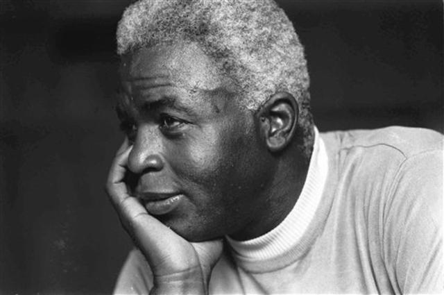 Jackie Robinson, who broke baseball's color barrier, alongside his Brooklyn  Dodgers teammates in 1947. (Robinson pictured with John Jorgensen, Pee Wee  Reese and…