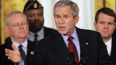 President Bush, accompanied by members of military families, in the East Room of the White House, Monday, April 16, 2007 