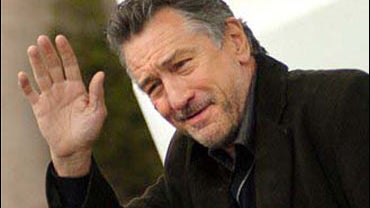 Actor Robert DeNiro waves 