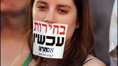 "Elections Now" reads the sticker 