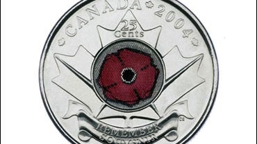This photo provided by the Royal Canadian Mint shows a 2004 silver-colored 25-cent piece, known as the poppy quarter. 